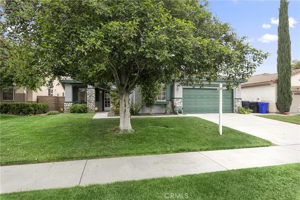 Lucious Front Yard With Beautiful Tree.