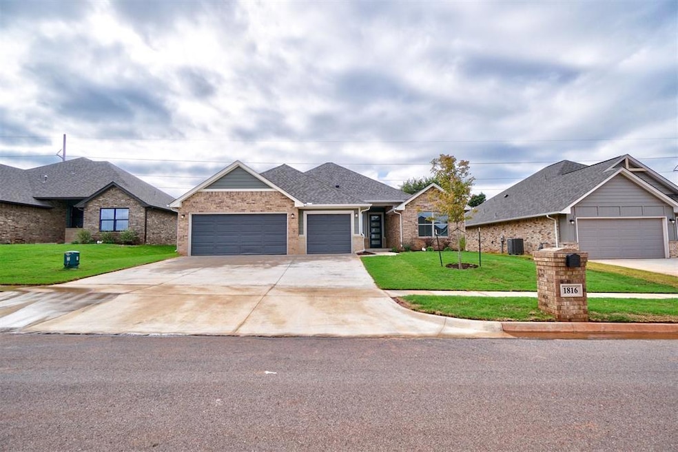 View of front of home featuring a garage, a front 
