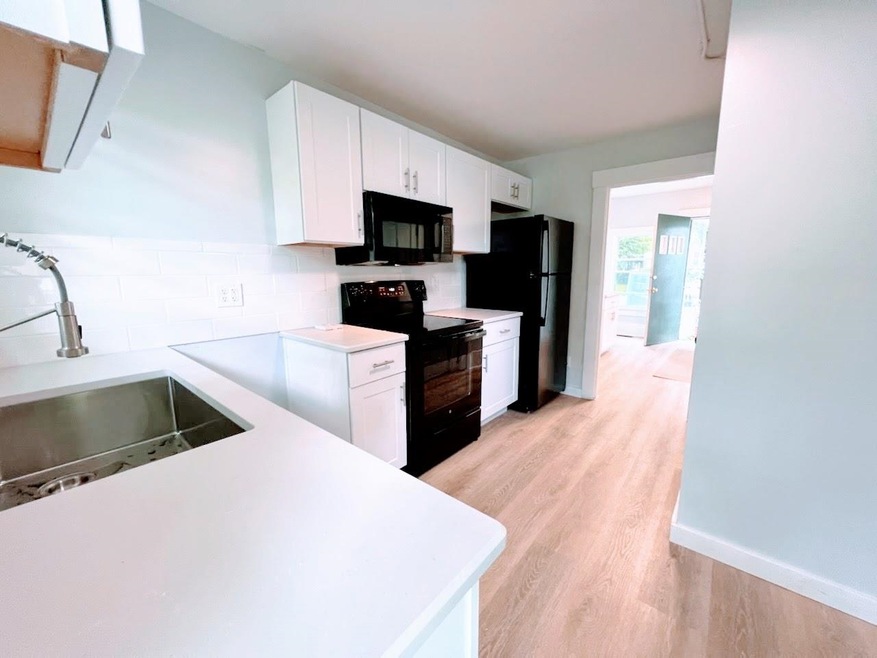 178 Pleasant St unit 3, Claremont, NH 03743 - photo 1