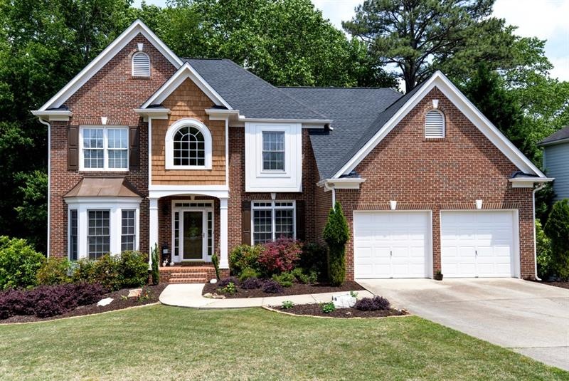 Meticulously maintained brick and cement siding ho