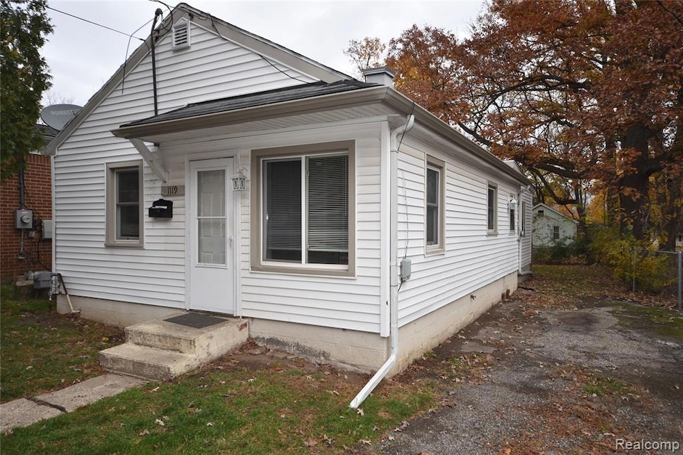 Shotgun-style home featuring a chimney