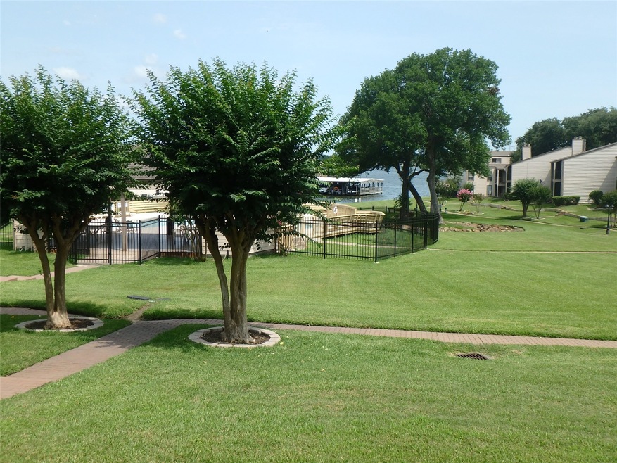 The view of Lake Conroe and the pool from your bac