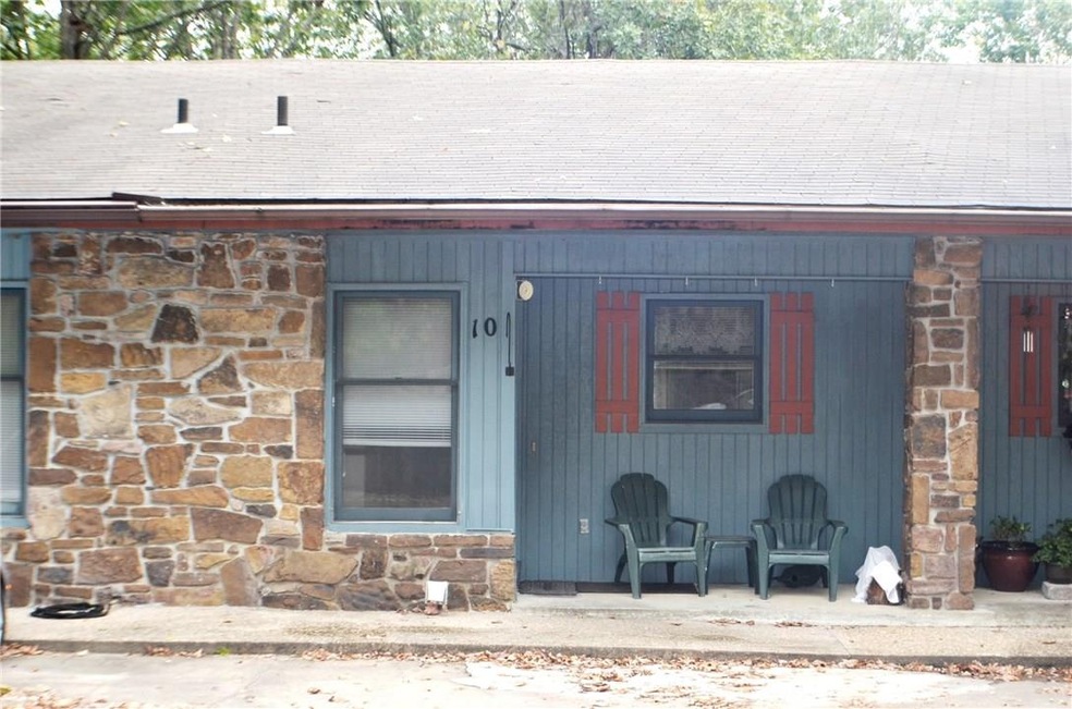 Notice the front porch area with chairs for relaxing.