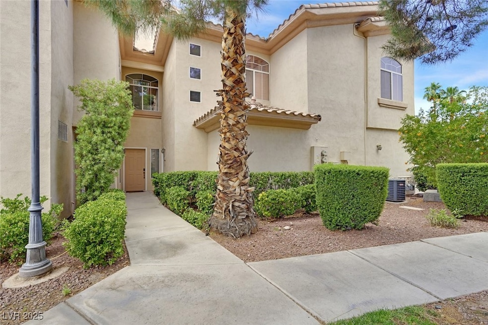 View of front of house offering tall palm trees an