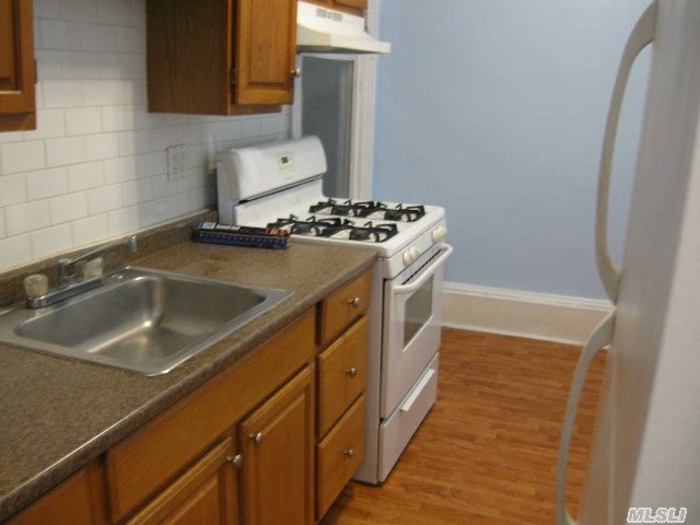 24606 Jericho Turnpike unit 2nd Fl, Floral Park, NY 11001 - photo 1