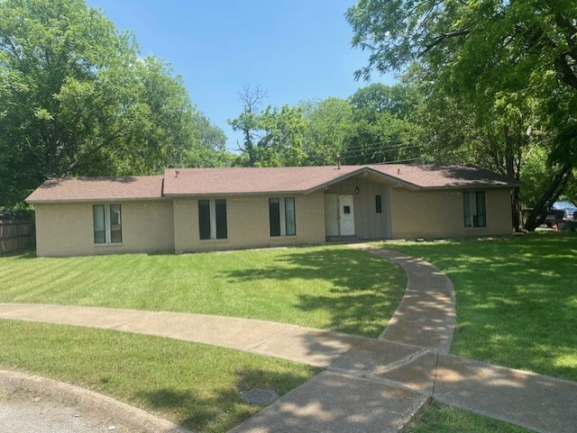 Single story home featuring a front yard