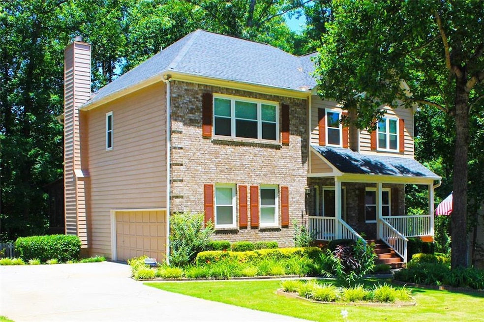 This brick-front beauty is waiting to welcome you 