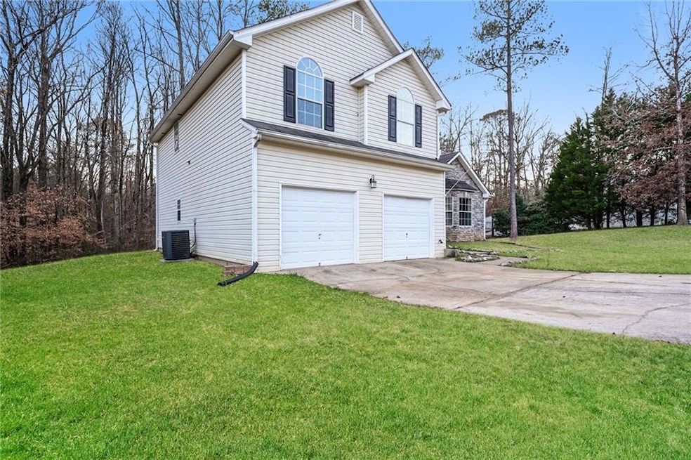 View of front of property featuring cooling unit, 