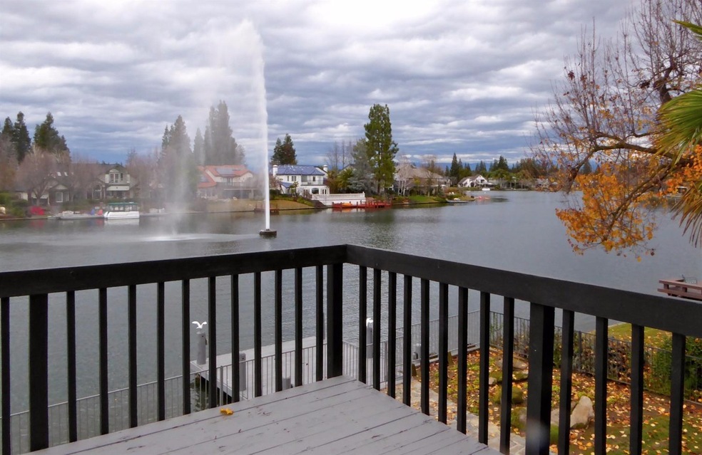 View of lighted fountain and snow capped mountains