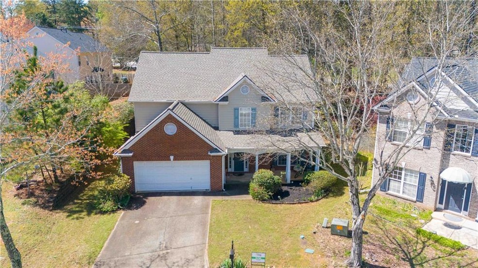 Front of property with a front lawn and a garage