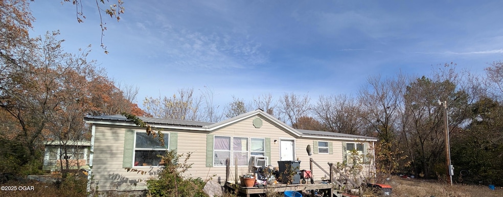 1399 W Empire Ln, Joplin, MO 64801 - photo 1