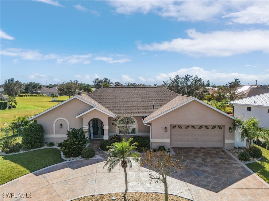 Ranch-style house with a front lawn and a garage