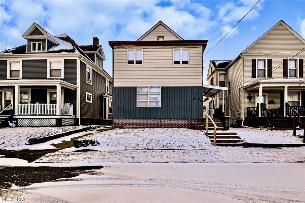 View of property featuring a porch