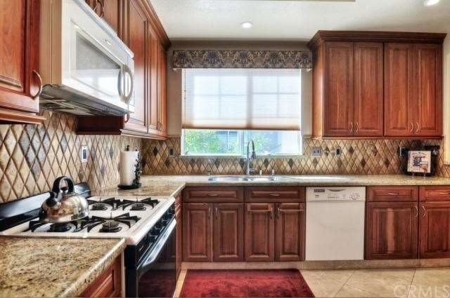 Beautifully remodeled kitchen defines luxury. 