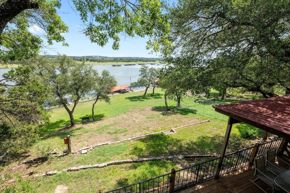 View of green lawn featuring a water view