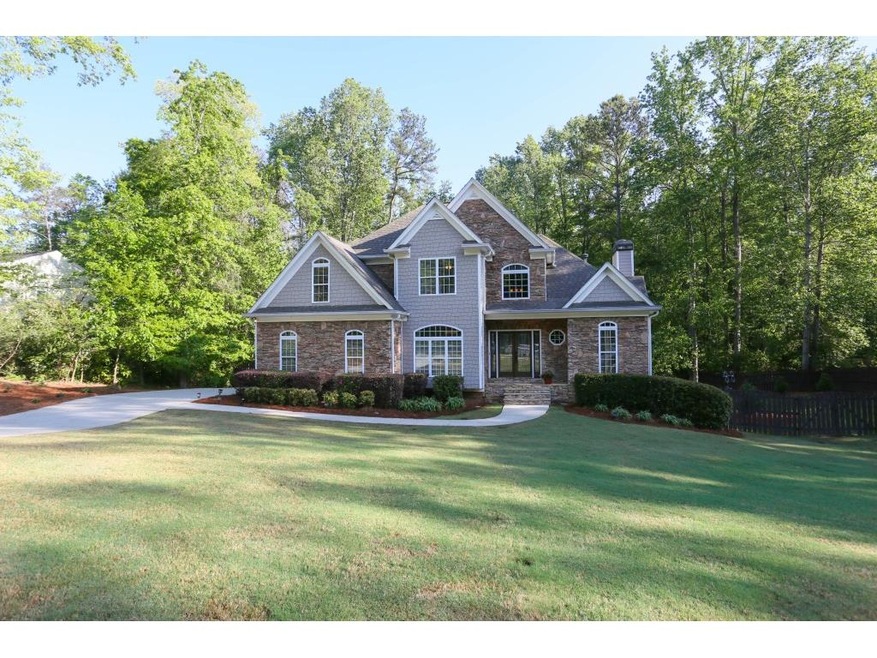 Gorgeous .77 acre level lot with newer constructio