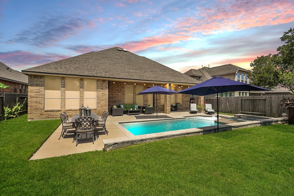 Check out this incredible pool to go along with this overall stunning home. Don't miss out on this dream backyard oasis!