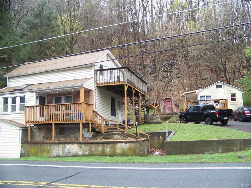 Front of both main home and studio apt. on right