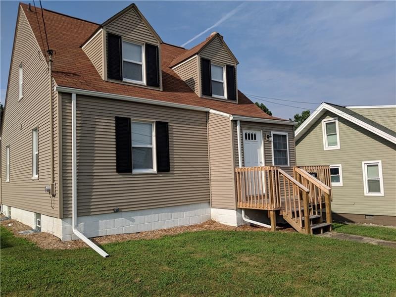 Front of house with new vinyl siding and a new fro