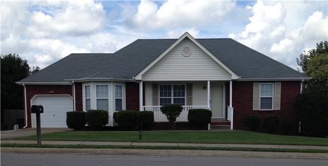 Perfectly manicured lawn with additional parking.
