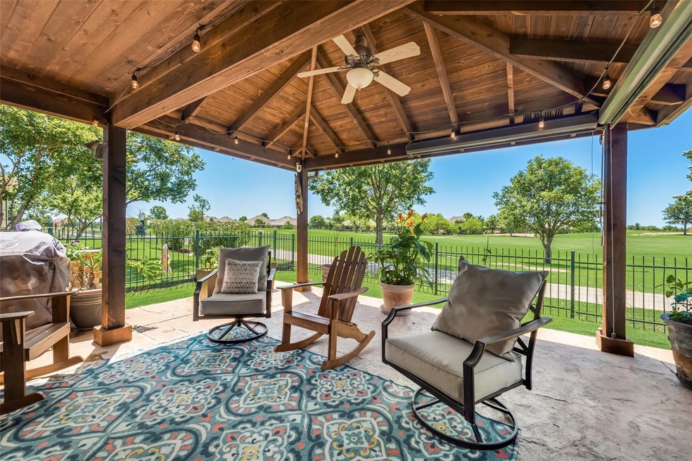 View of terrace featuring ceiling fan, a gazebo, a