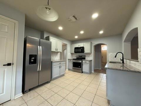 Kitchen featuring appliances with stainless steel