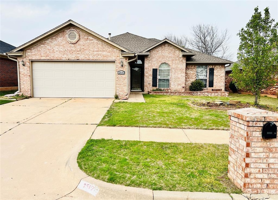 Ranch-style house with an attached garage, a front