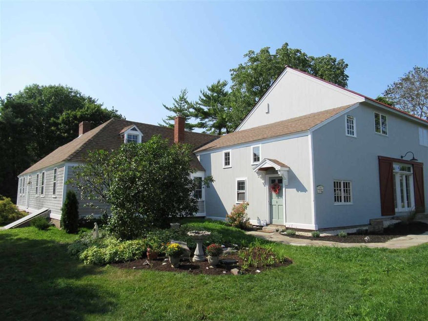 Tucked away on a private 1 acre setting, yet only 