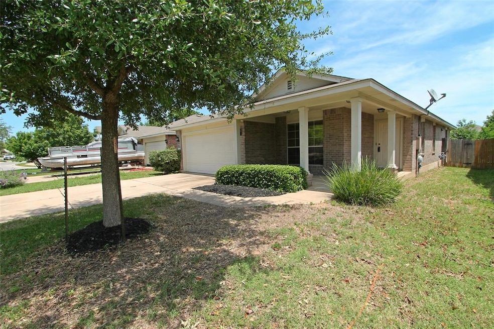 Ranch-style home with brick siding, driveway, an 