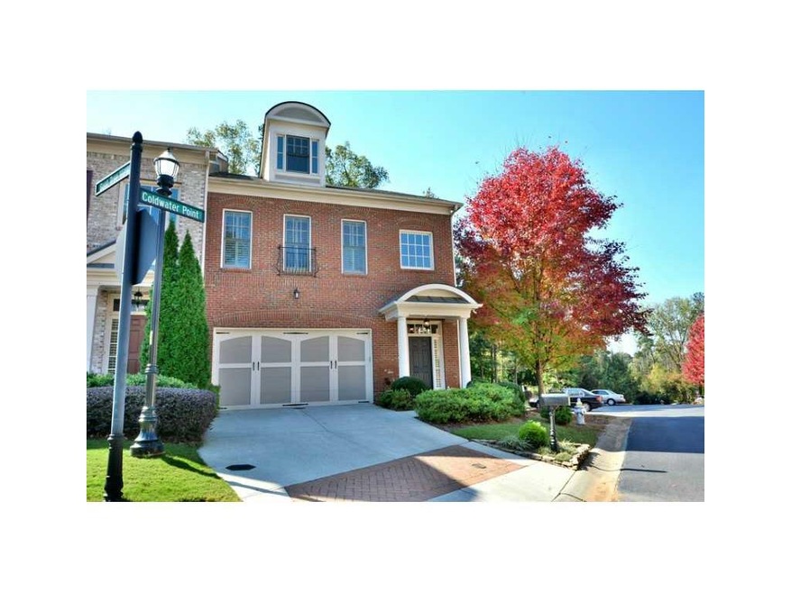 Facade/Exterior Front. long, level driveway, corner and end unit