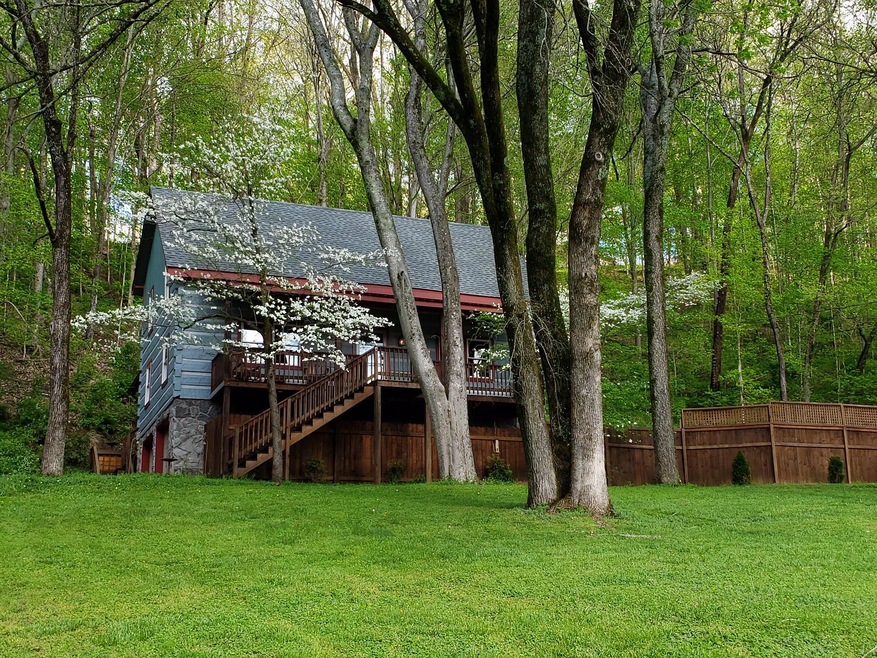 Welcome to 1108 Hunting Creek Road! This unique cabin is nestled on 2.4 wooded acres. The nature around this home is incredible.