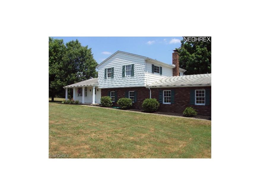 Set back from road.  Nicely landscaped, mature tre