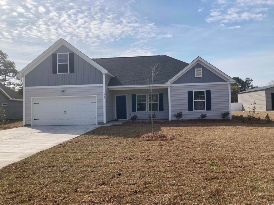 View of front of house with a front lawn, driveway