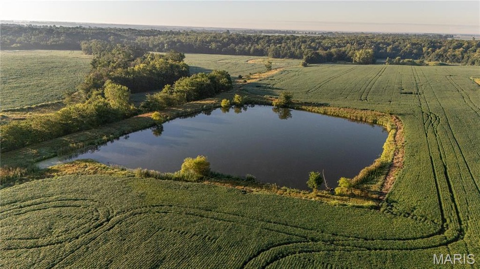 Aerial overview of property's location featuring a nearby body of water and rural landscape