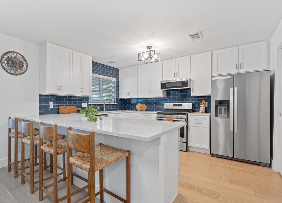 Kitchen featuring stainless steel appliances, a p
