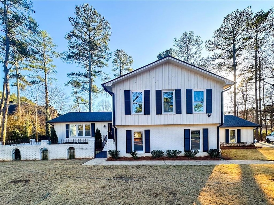 Tri-level home featuring brick siding