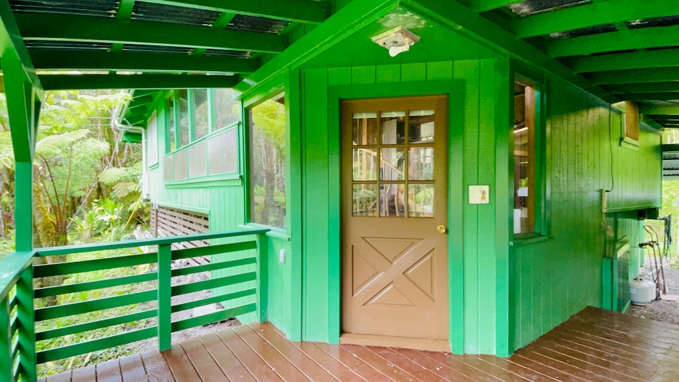 Enter the Main Home through this welcoming covered lanai that overlooks the property.