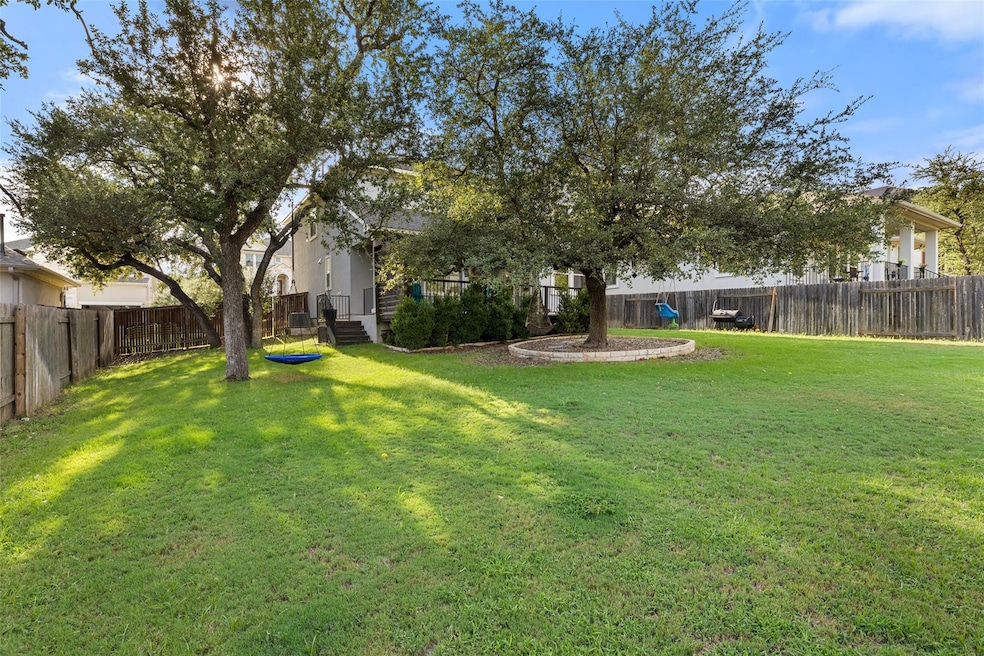 One of the most spacious yards in all of Bella Colinas! Established trees provide privacy and a gorgeous green view!