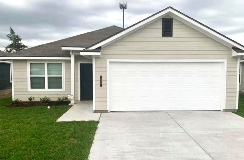 Well maintained exterior front of home. Features 2
