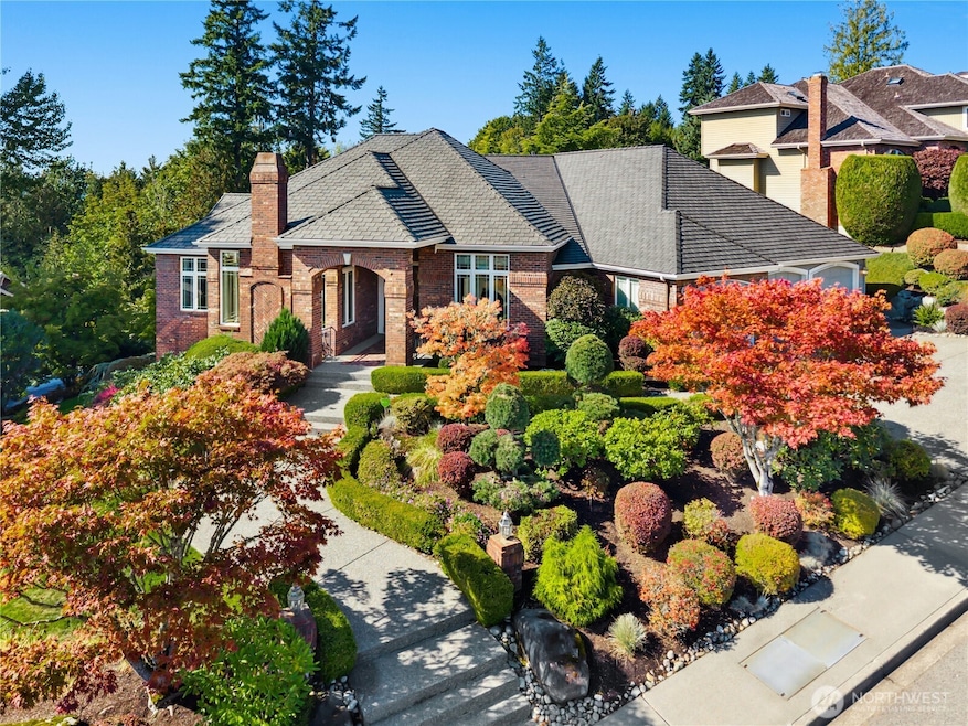 This stately brick home rises gracefully above the boulevard, a distinguished presence in The Summit.