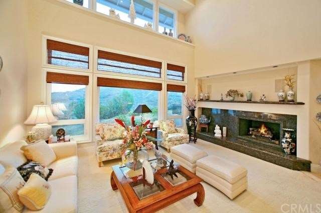 Formal Living Room with marble fireplace, two stor