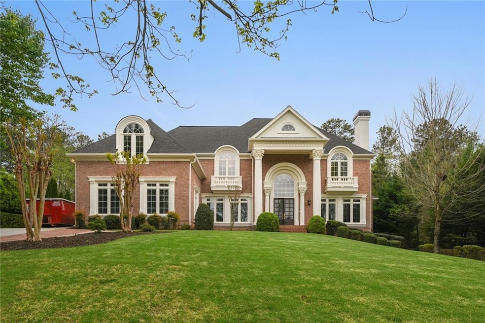 Greek revival inspired property featuring a front 