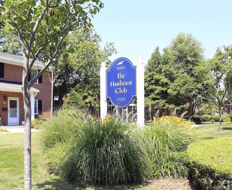 Community sign featuring a lawn
