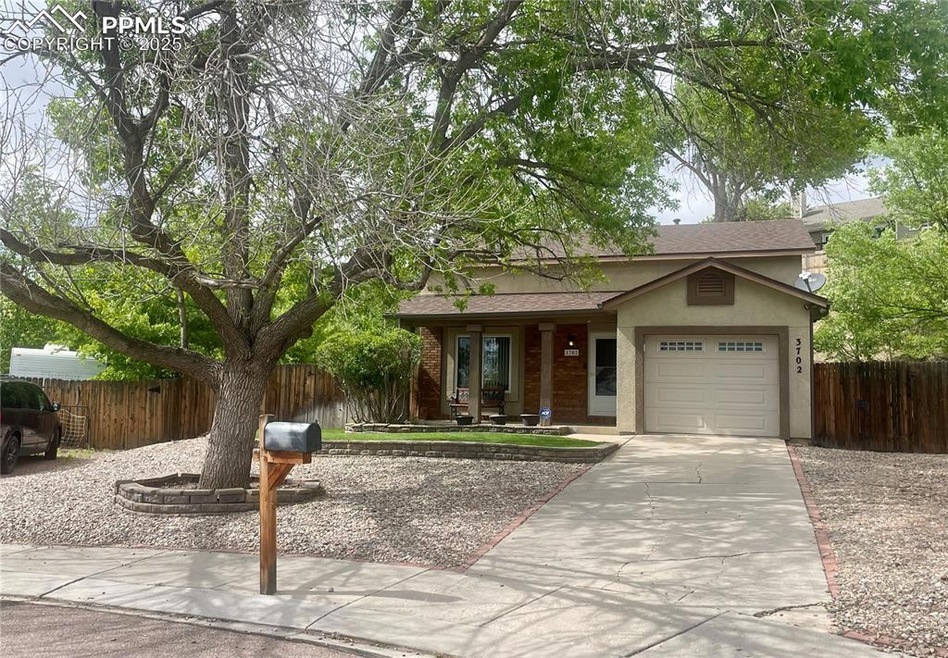 View of front of house with stucco siding