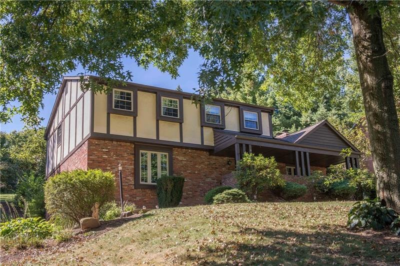 Stately Tudor-style home on a cul-de-sac street in