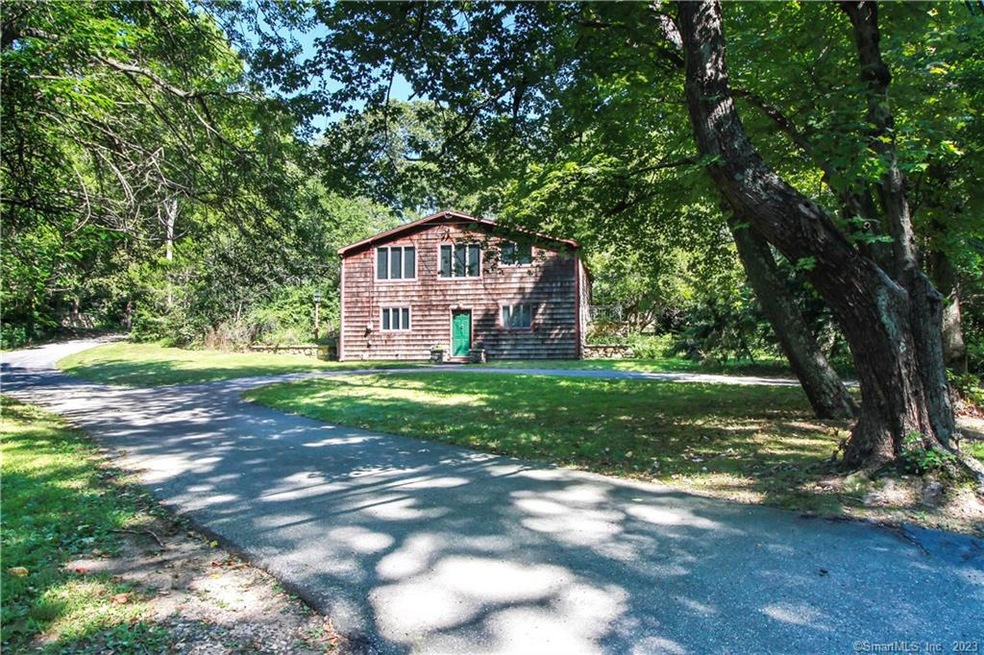 Front view with circular driveway