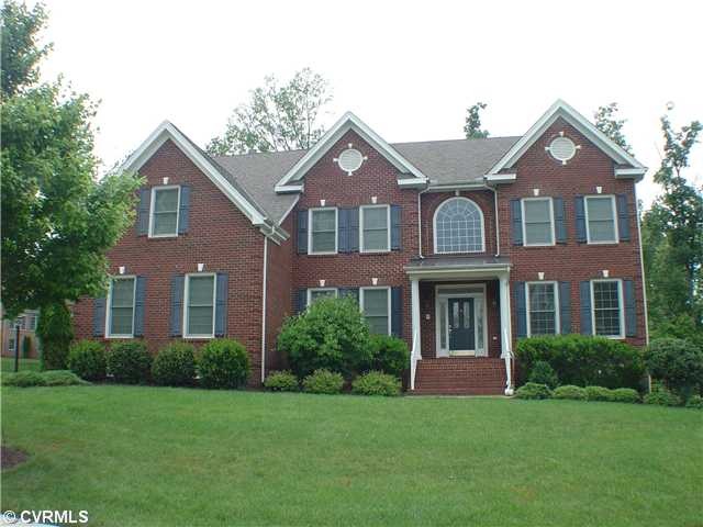 Exterior Front - Brick front, huge 3 car garage, m