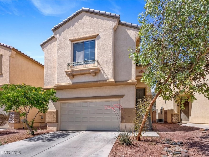 View of front of home featuring a garage, stucco s