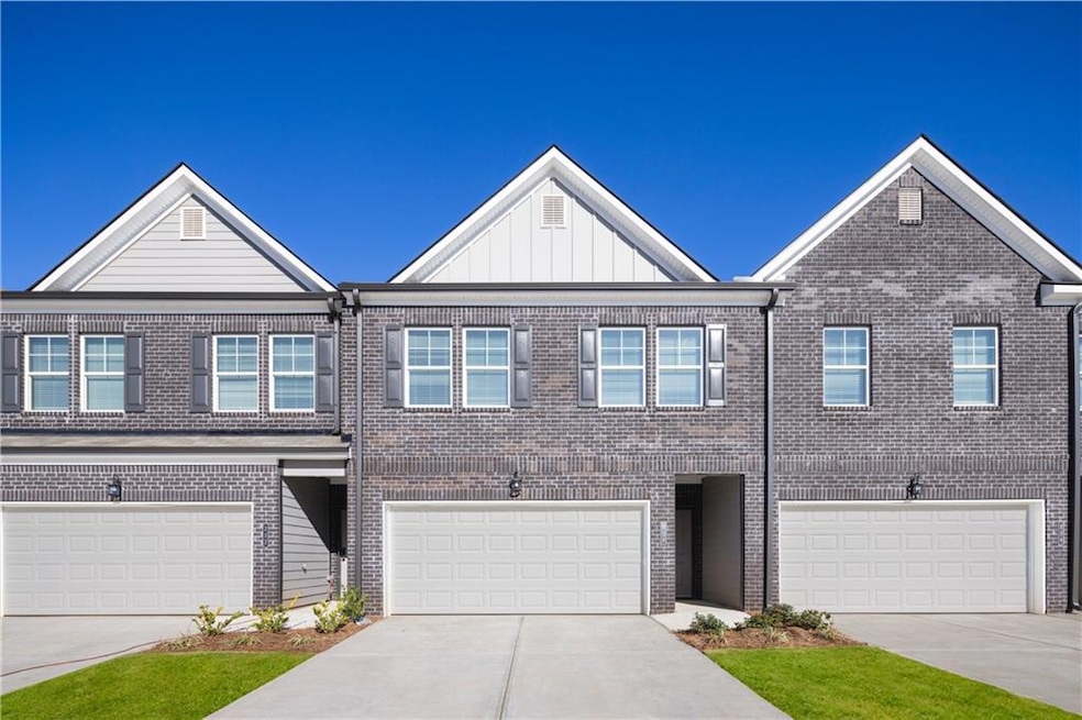 Townhome / multi-family property with a garage