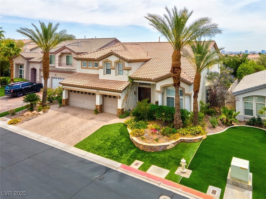 View of front of property with stucco siding, a ti